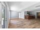 Finished basement with laminate floors and walkout access at 9259 Oak Knoll Ln, Fishers, IN 46037
