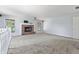 Spacious bonus room with a brick fireplace and carpet at 9259 Oak Knoll Ln, Fishers, IN 46037