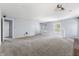 Large bonus room with a projector, carpet, and a view of the lower level at 9259 Oak Knoll Ln, Fishers, IN 46037