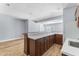 Basement kitchenette with white countertops and wood cabinets at 9259 Oak Knoll Ln, Fishers, IN 46037