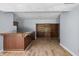 Basement bar area with wood cabinetry and laminate flooring at 9259 Oak Knoll Ln, Fishers, IN 46037