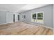 Finished basement with laminate flooring and backyard access at 9259 Oak Knoll Ln, Fishers, IN 46037