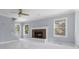 Living room with a brick fireplace and hardwood flooring at 9259 Oak Knoll Ln, Fishers, IN 46037