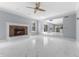 Spacious living room features a fireplace and marble flooring at 9259 Oak Knoll Ln, Fishers, IN 46037