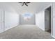 Large bedroom with vaulted ceiling, carpet, and window view at 9259 Oak Knoll Ln, Fishers, IN 46037