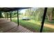 Backyard with deck, trampoline, and mature trees at 9265 N Evans Rd, Monrovia, IN 46157