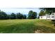 Spacious side yard with green grass at 9265 N Evans Rd, Monrovia, IN 46157