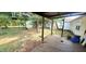 Backyard with deck, playset, and propane tank at 9265 N Evans Rd, Monrovia, IN 46157