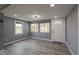 Light gray living room with new flooring and updated windows at 3730 Prospect St, Indianapolis, IN 46203