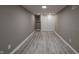 Finished basement with gray walls, vinyl flooring and a closet at 3730 Prospect St, Indianapolis, IN 46203