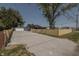 Newly renovated home with gravel driveway and wooden fence at 3730 Prospect St, Indianapolis, IN 46203