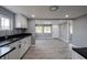 Modern kitchen with white cabinets, black countertops, and stainless steel sink at 3730 Prospect St, Indianapolis, IN 46203
