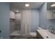 Modern bathroom with a walk-in shower, toilet and floating vanity at 3730 Prospect St, Indianapolis, IN 46203