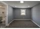 Bedroom with gray walls, carpet, and a view of the bathroom at 3730 Prospect St, Indianapolis, IN 46203