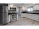 Modern kitchen featuring stainless steel appliances and white shaker cabinets at 3730 Prospect St, Indianapolis, IN 46203