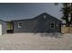 Gray house exterior with gravel driveway and partial view of garage at 3730 Prospect St, Indianapolis, IN 46203