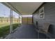 Covered back patio with two chairs and a view of the backyard at 3730 Prospect St, Indianapolis, IN 46203