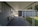 Covered back patio with two chairs and access to the backyard at 3730 Prospect St, Indianapolis, IN 46203