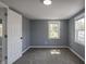 Spacious bedroom with gray walls and new carpeting at 3730 Prospect St, Indianapolis, IN 46203
