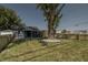 Charming gray house with a large tree in front at 3730 Prospect St, Indianapolis, IN 46203
