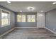 Light gray living room with new flooring and updated windows at 3730 Prospect St, Indianapolis, IN 46203