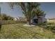 Large backyard with a shed, wooden fence, and a large tree at 3730 Prospect St, Indianapolis, IN 46203