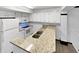 Bright kitchen featuring granite countertops and white cabinets at 3213 Oceanline E Dr, Indianapolis, IN 46214