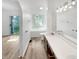 Bathroom with soaking tub and double vanity at 3213 Oceanline E Dr, Indianapolis, IN 46214