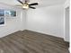 Simple bedroom with hardwood floors and a ceiling fan at 3213 Oceanline E Dr, Indianapolis, IN 46214