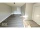 Large bedroom with gray vinyl flooring and neutral walls at 6733 S Cross St, Pendleton, IN 46064