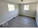 Spacious bedroom with gray vinyl flooring and neutral walls at 6733 S Cross St, Pendleton, IN 46064