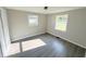 Bright bedroom with gray vinyl flooring and ample closet space at 6733 S Cross St, Pendleton, IN 46064