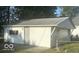 Detached single car garage with a paved driveway at 6733 S Cross St, Pendleton, IN 46064