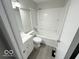 Updated bathroom with white vanity, tub and shower at 6733 S Cross St, Pendleton, IN 46064