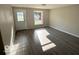 Bright living room with gray vinyl flooring and neutral walls at 6733 S Cross St, Pendleton, IN 46064