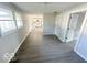 Bright living room features gray vinyl flooring and an open floor plan at 6733 S Cross St, Pendleton, IN 46064