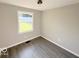 Bright bedroom with neutral walls and laminate flooring at 6733 S Cross St, Pendleton, IN 46064