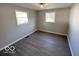 Well-lit bedroom with gray vinyl flooring and neutral walls at 6733 S Cross St, Pendleton, IN 46064