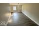 Spacious living area with gray vinyl flooring and lots of natural light at 6733 S Cross St, Pendleton, IN 46064