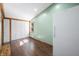 Bright bonus room with hardwood floors and white doors at 7393 N Thunder Creek Ridge Rd, Morgantown, IN 46160