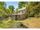Log cabin home with a brown addition and a green metal roof at 7393 N Thunder Creek Ridge Rd, Morgantown, IN 46160