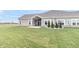 Backyard of a house with a patio, landscaping, and HVAC units at 6210 Fairview Dr, McCordsville, IN 46055