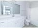 Clean, modern bathroom with white vanity, shower, and light gray flooring at 6210 Fairview Dr, McCordsville, IN 46055