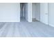 Empty bedroom with gray carpet and open doorways to bathroom and closet at 6210 Fairview Dr, McCordsville, IN 46055