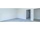 Empty bedroom with gray carpet and open doorways to bathroom and closet at 6210 Fairview Dr, McCordsville, IN 46055