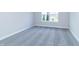 Empty bedroom with gray carpeting and white trim, ready for personalization at 6210 Fairview Dr, McCordsville, IN 46055