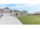 View of a house with a driveway, attached garage, and green lawn at 6210 Fairview Dr, McCordsville, IN 46055