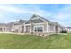 Exterior view of a home with green siding, white trim, and a covered entryway at 6210 Fairview Dr, McCordsville, IN 46055