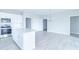 Open-concept kitchen and dining area with white cabinetry, stainless steel appliances, and an island at 6210 Fairview Dr, McCordsville, IN 46055