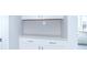 Laundry room with white cabinets, countertop, and ample storage space at 6210 Fairview Dr, McCordsville, IN 46055